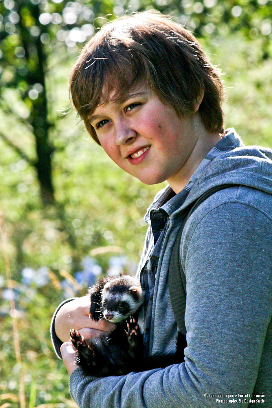 Behind the scenes still of Connor Stanhope and Falcor the Ferret on set of Jake & Jasper: A Ferret Tale.