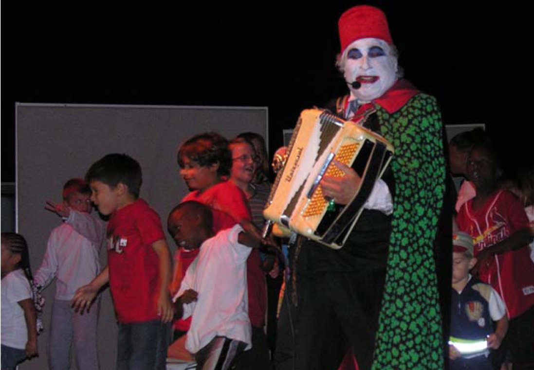 Count Smokula performs on stage with kids on base, in Guantanamo Bay, Cuba