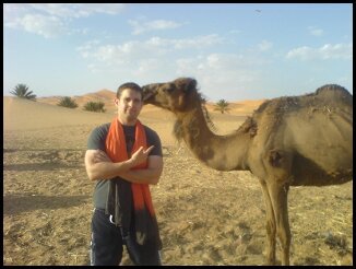 Matthew Stefiuk filming on location in Morocco with 'Reuben' the Camel