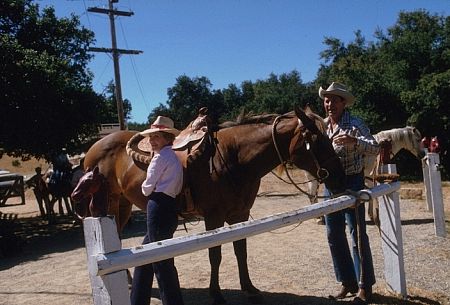 Ronald Reagan with Nancy Reagan next to a horse