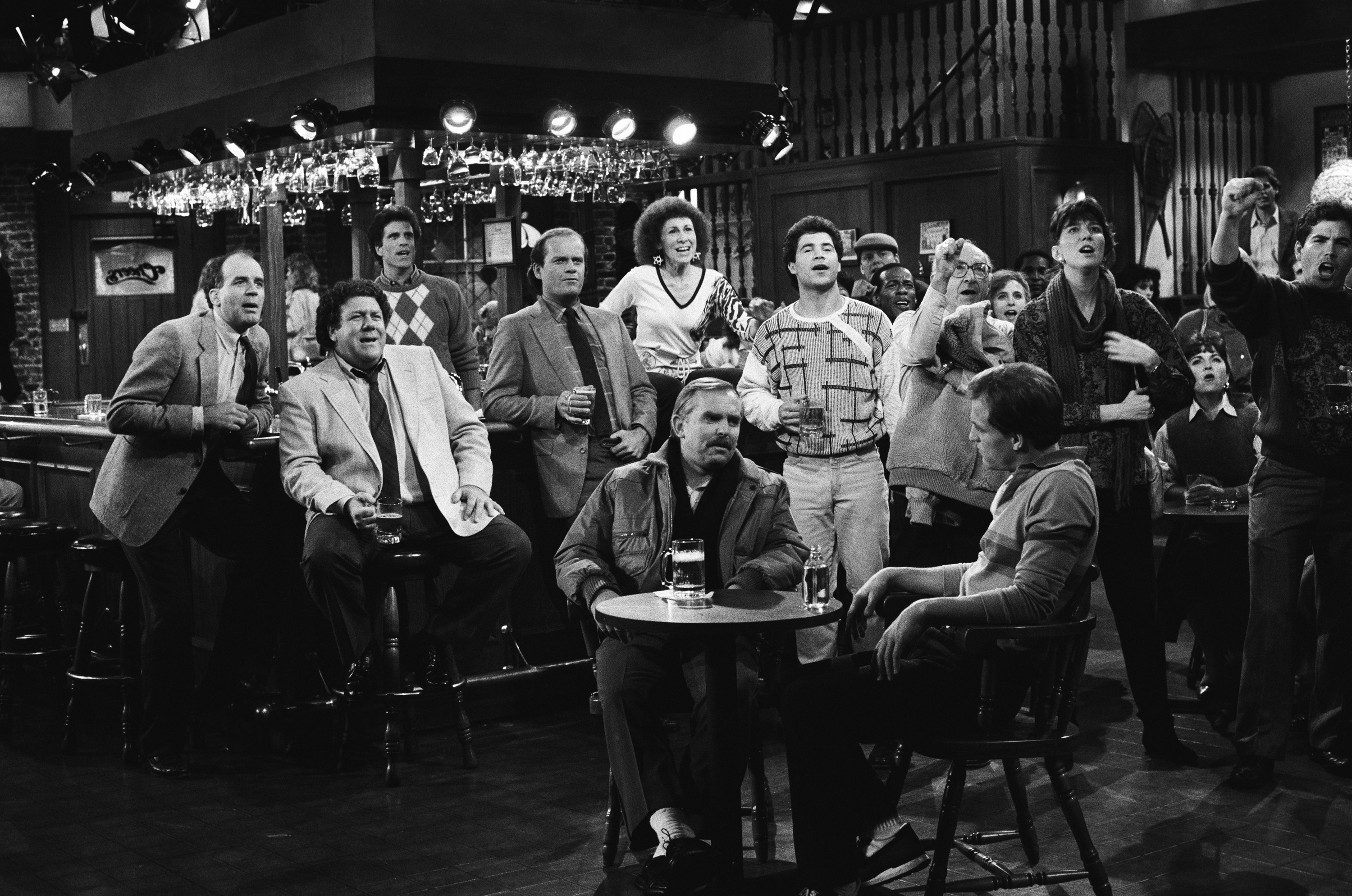 Still of Woody Harrelson, Ted Danson, Kelsey Grammer, John Ratzenberger, George Wendt, Johnny Gilbert and Rhea Perlman in Cheers (1982)