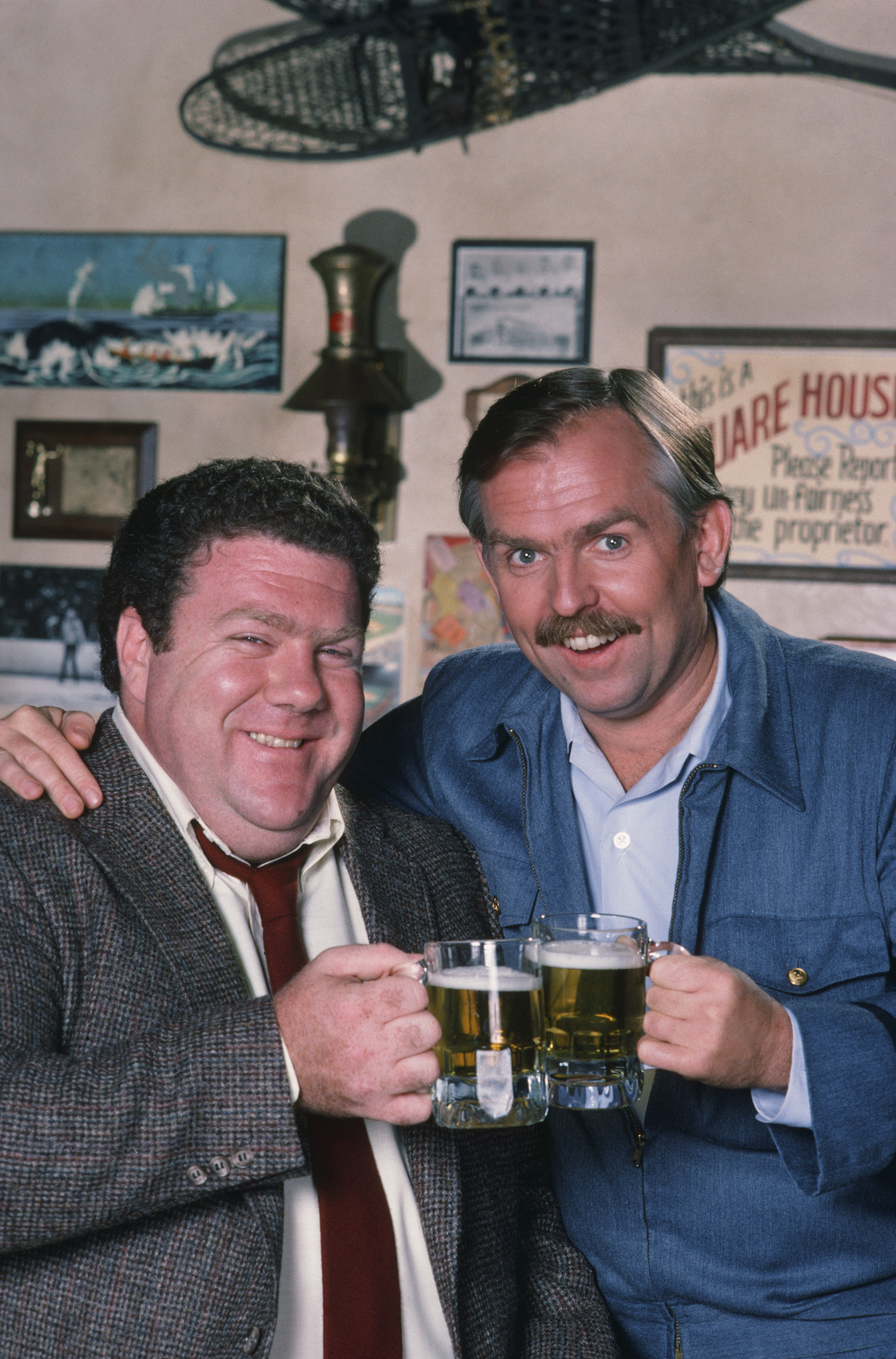 Still of John Ratzenberger and George Wendt in Cheers (1982)