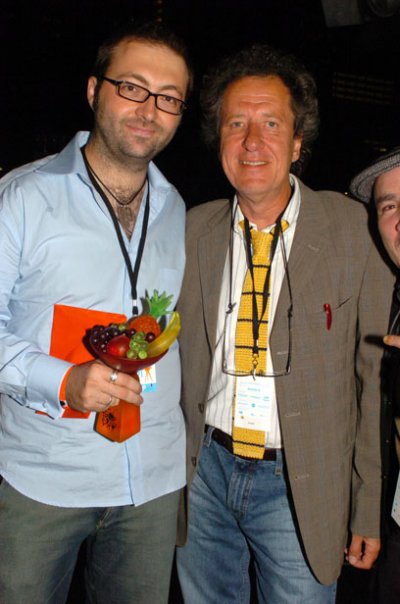Luke Eve receiving the Best Film trophy from Geoffrey Rush at Tropfest 2005.