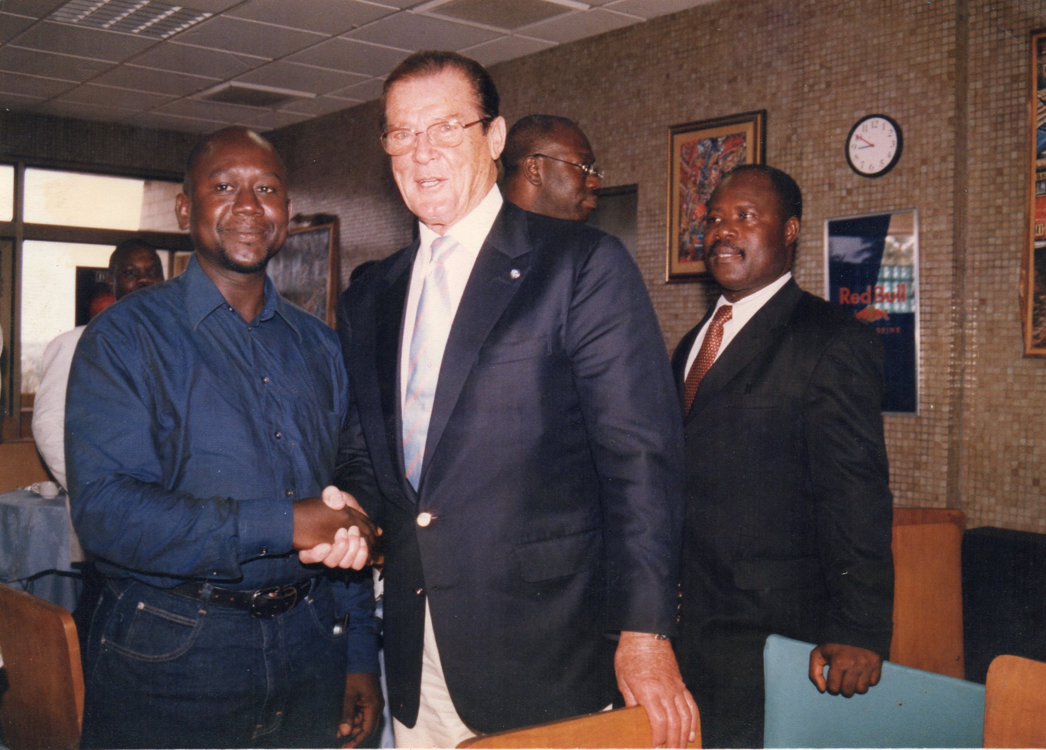 Goodwill Ambassador Roger Moore and Jojo Robertson in Ghana 2000