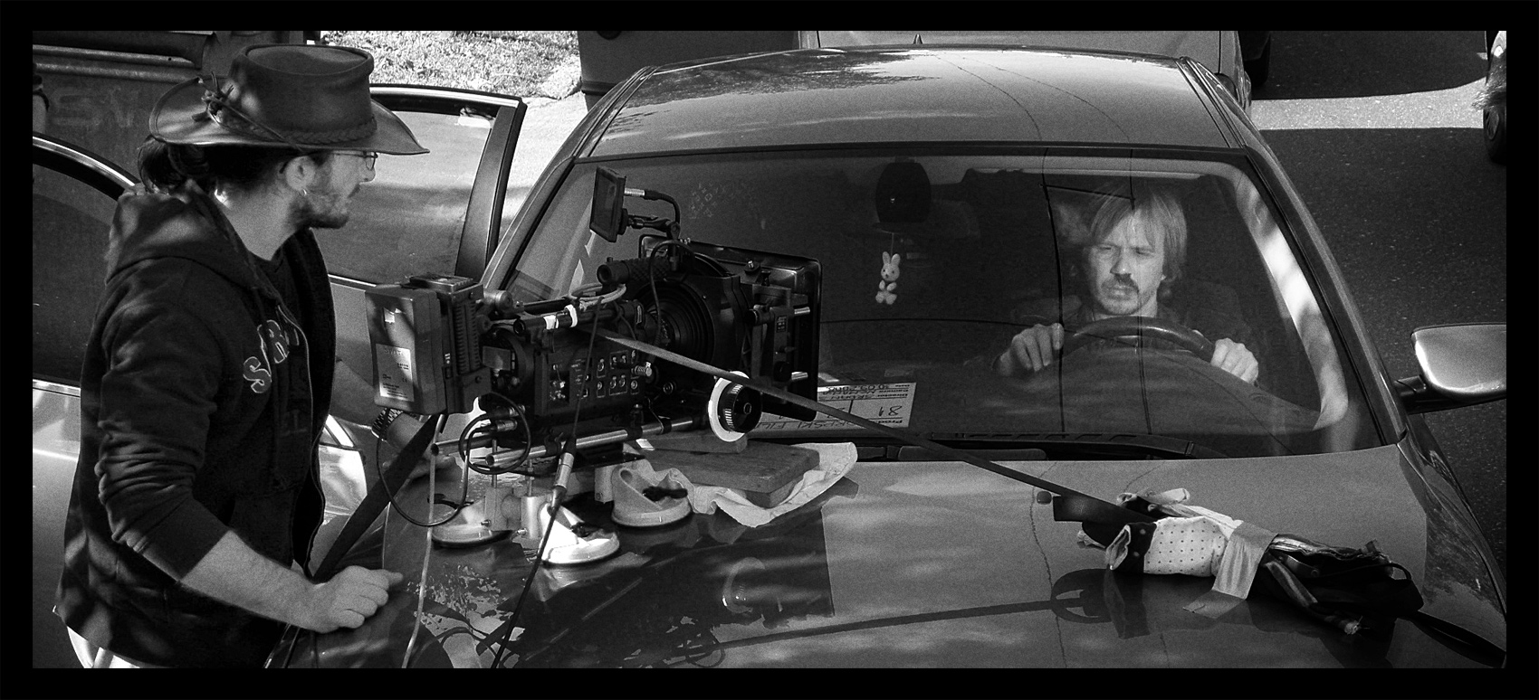 SERBIAN FILM Final adjustments for car shoot. Behind the wheel, Milos (Srdjan Todorovic).