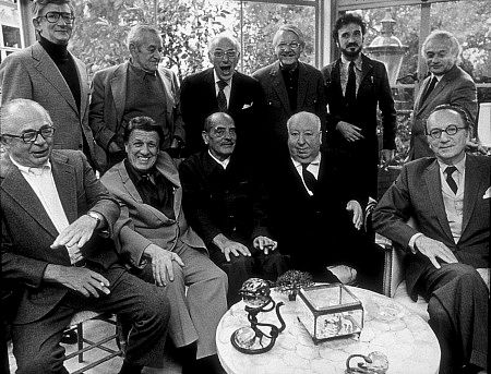 Directors Group, Nov.1972. George Cukor Hosts a party for Luis Bunuel. Back Row from left: Robert Mulligan, William Wyler, George Cukor, Robert Wise, Jean-Claude Carriere, and Serge Silverman. Front Row from left: Billy Wilder, George Stevens, Luis Bunuel, Alfred Hitchcock, and Rouben Mamoulin.