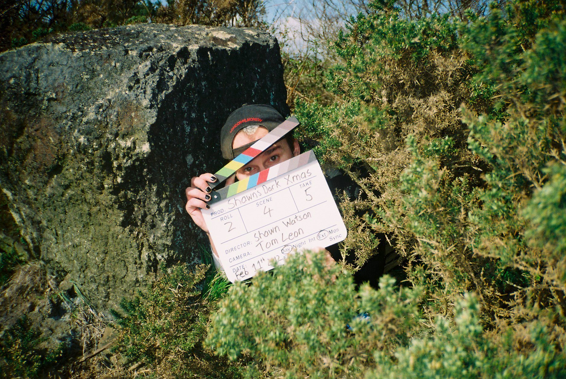 Shawn with the clapperboard on location.