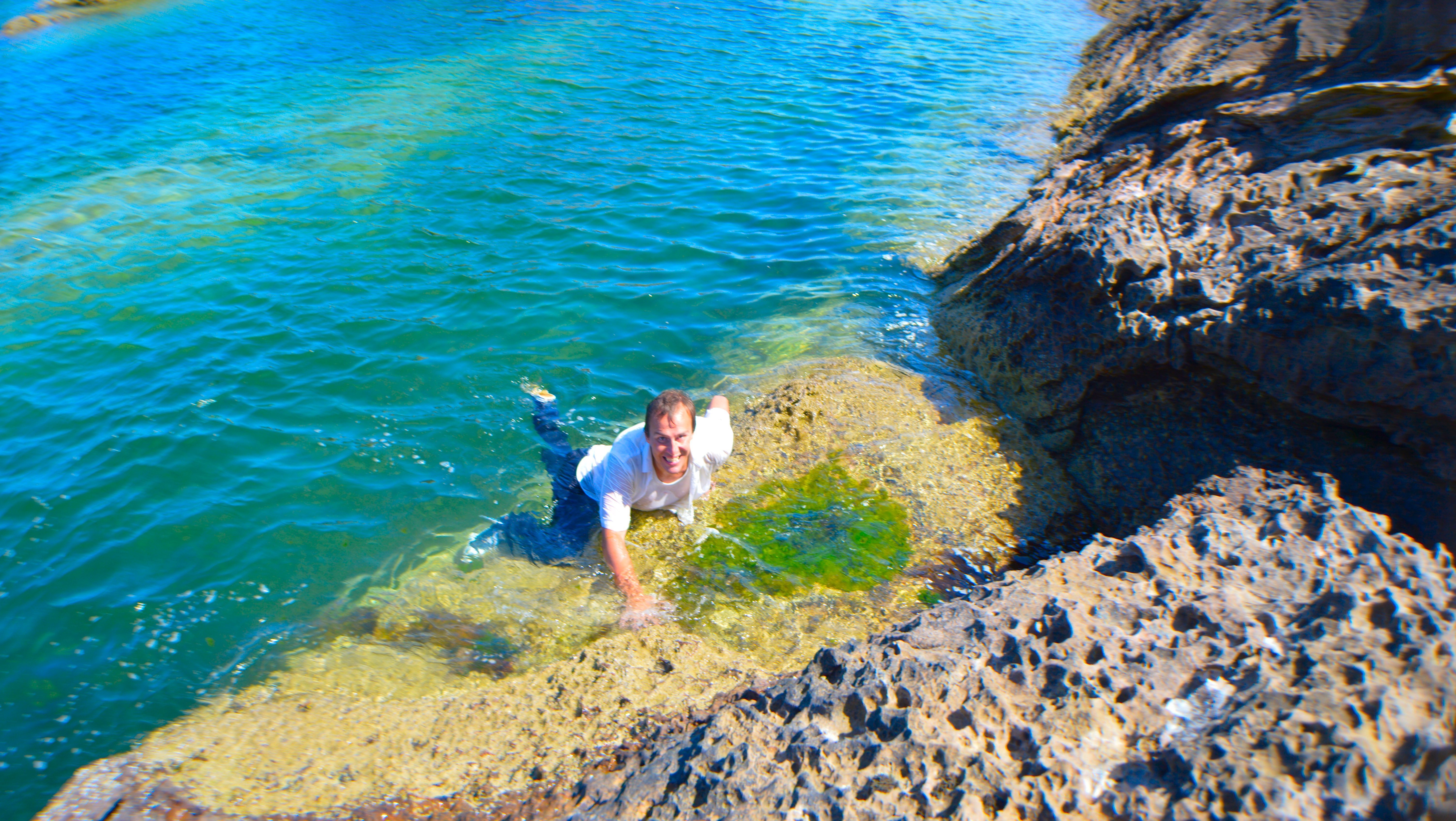 Shawn climbs out of the water on location.