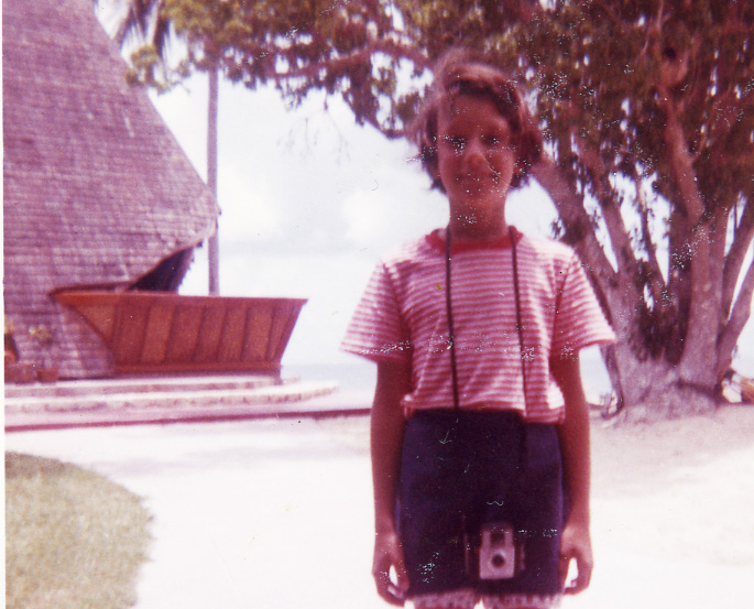Dana Plays with first camera age nine at grandmother's hotel, Galley Bay Surf Club, Antigua, West Indies.