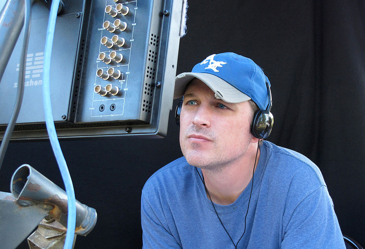 Director Eric Colley watches the monitor on the set of the World War II film The Last Rescue.