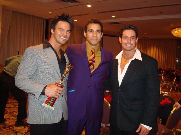 2008 Mr. Romance winner, Chris Winters poses with Actor Adrian Paul (Highlander series) and 2007 Mr. Romance Jason Santiago