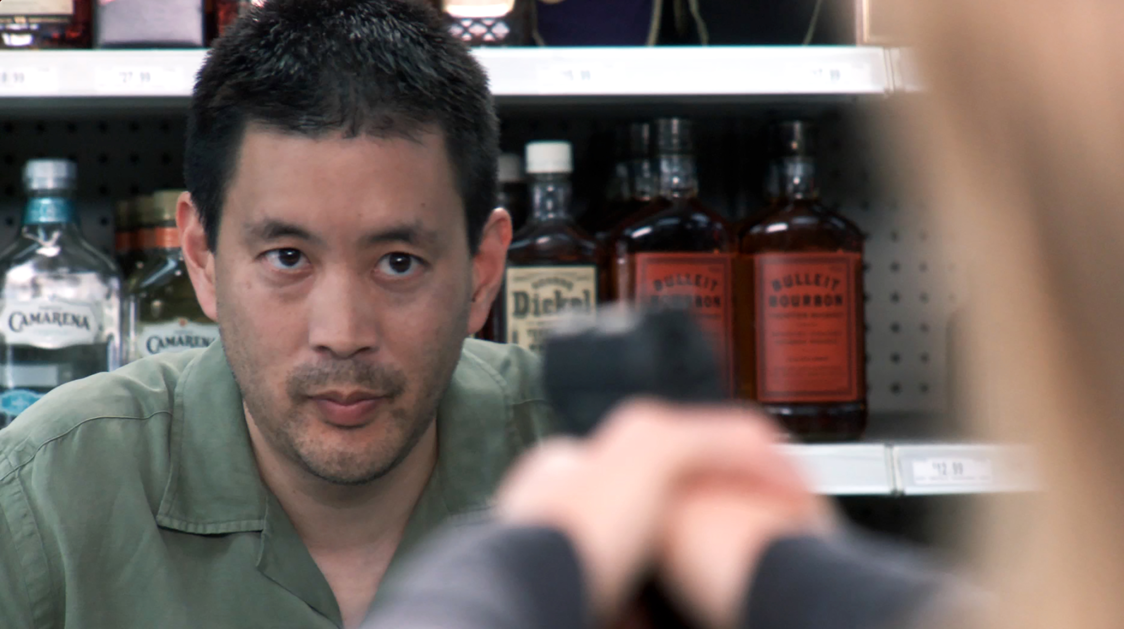 (l to r) Scott Takeda as Don being held at gunpoint by Audrey Walters as Marlee in the indie short dark comedy LAST CALL (2011)