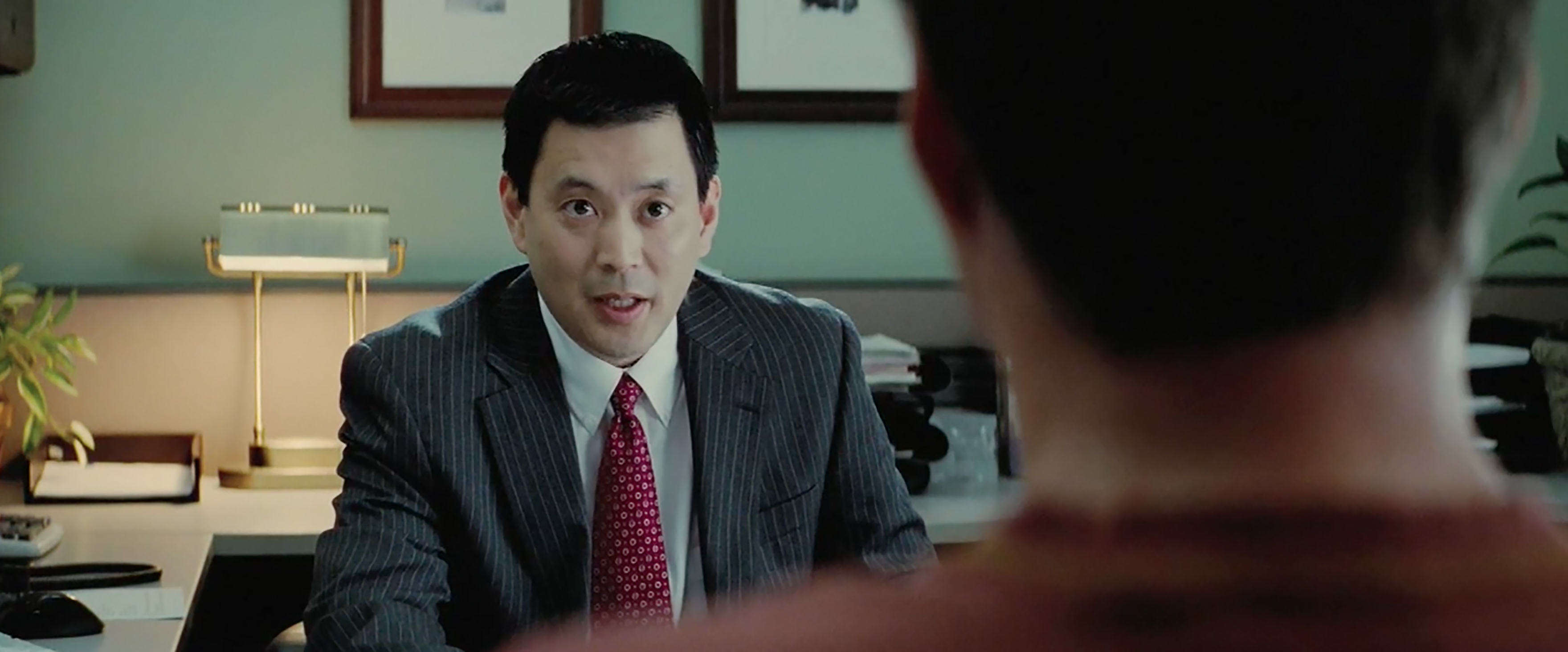 (l to r) Scott Takeda as Bank Manager and Will Ferrell as Nick Halsey in the indie drama EVERYTHING MUST GO, a Lionsgate release.