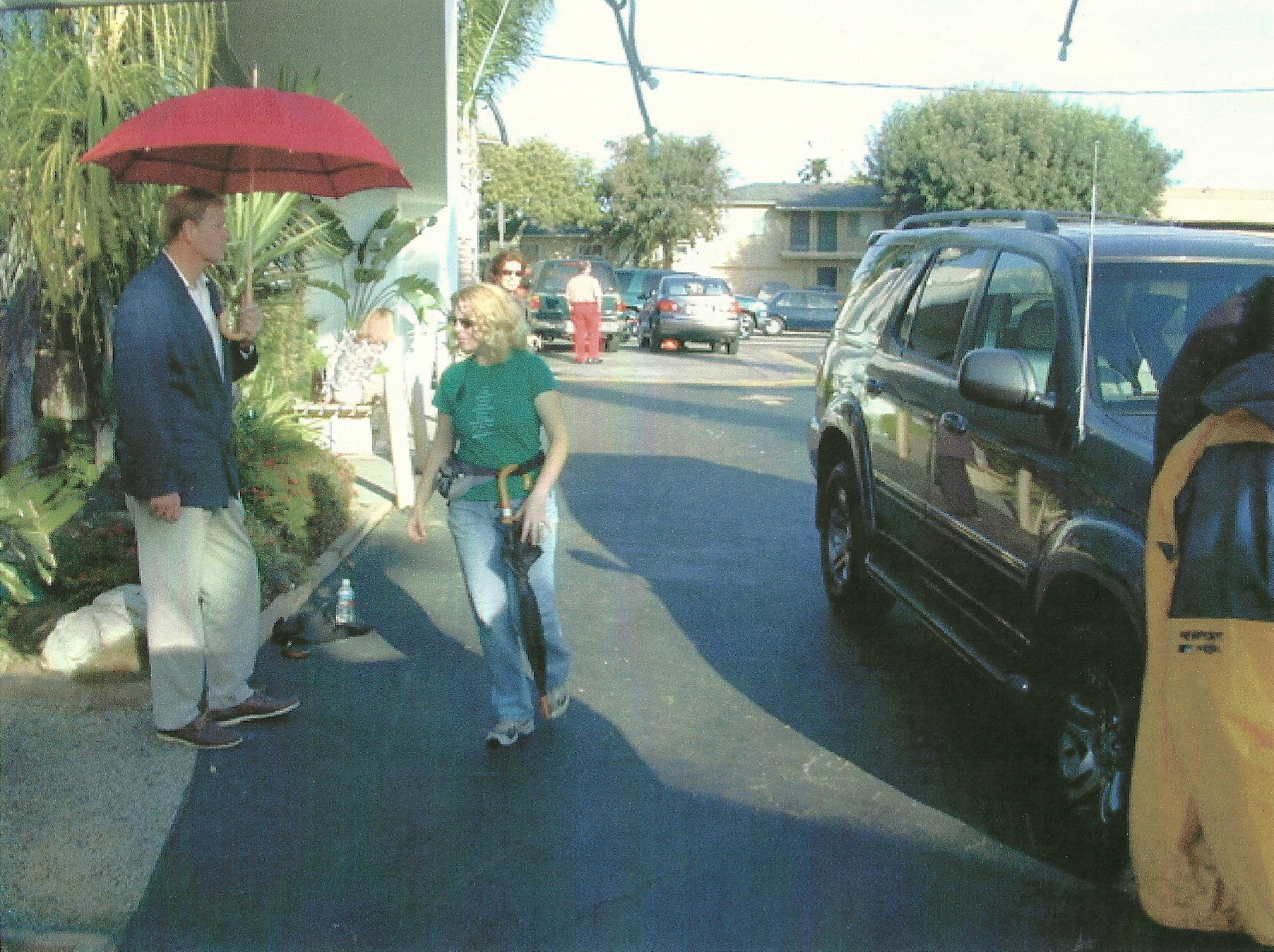 Setting up a rain scene for Bewitched the Movie. Note hoses above car as Steve Stands In to rehearse scene.