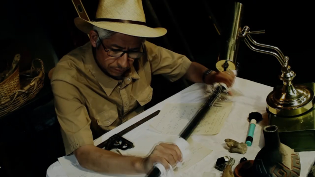 Dr. Ashiabi, Arab archaeologist, studies an ancient (and unbeknownst to him, enchanted) sword; 