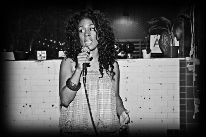 Teneale Bender hosting Verbally Loud Open Mic at The Harlem Place Cafe back in 2009!