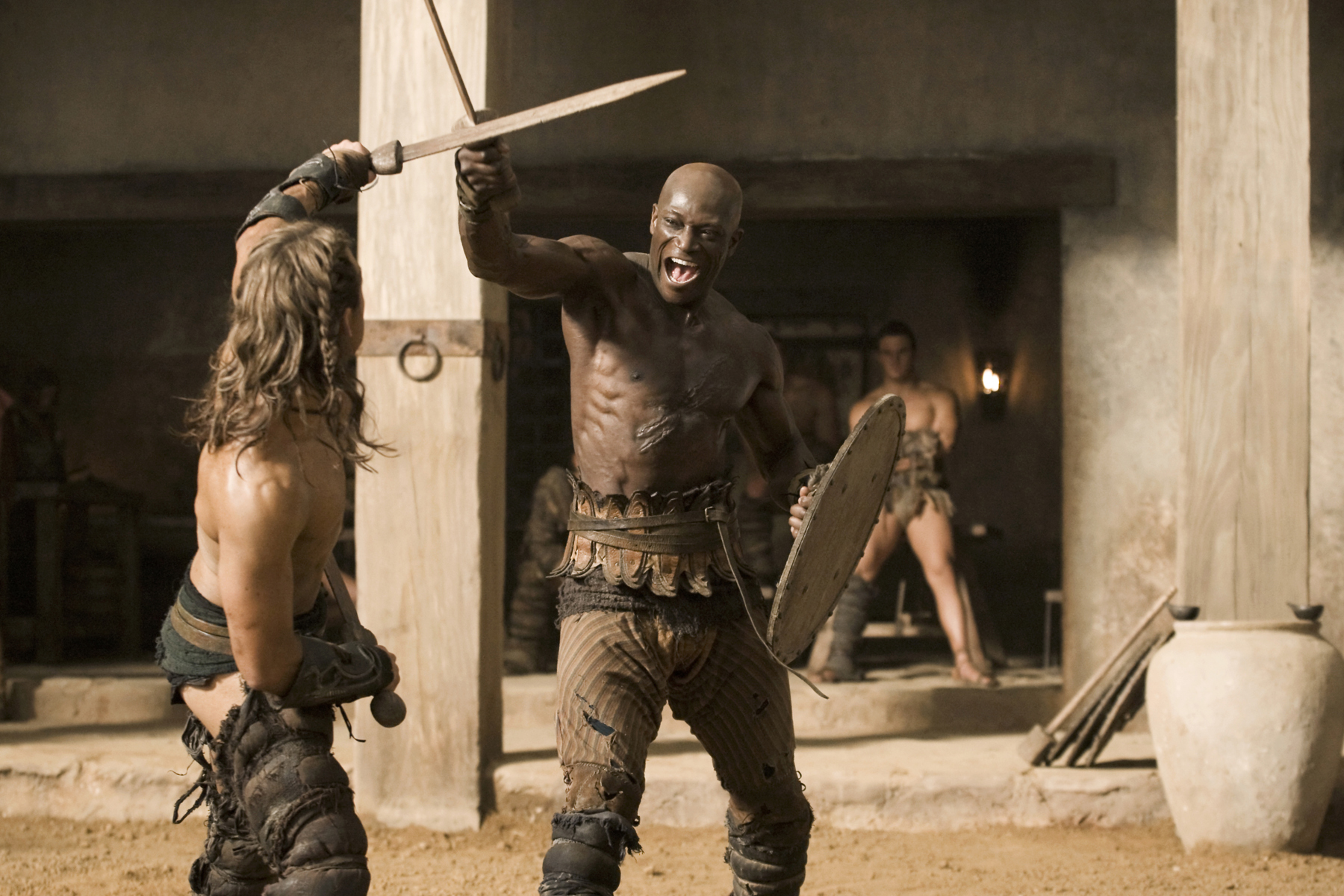 Still of Peter Mensah and Dustin Clare in Spartacus: Gods of the Arena (2011)