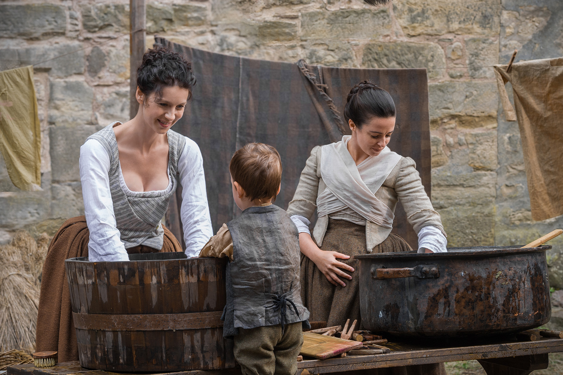 Still of Laura Donnelly and Caitriona Balfe in Outlander (2014)