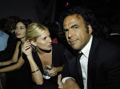 Alejandro González Iñárritu and Sienna Miller