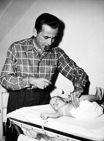 Humphrey Bogart and his son, Stephen, at home, 1949.