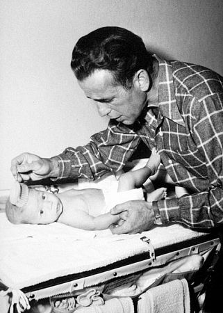 Humphrey Bogart and his son, Stephen, at home, 1949.