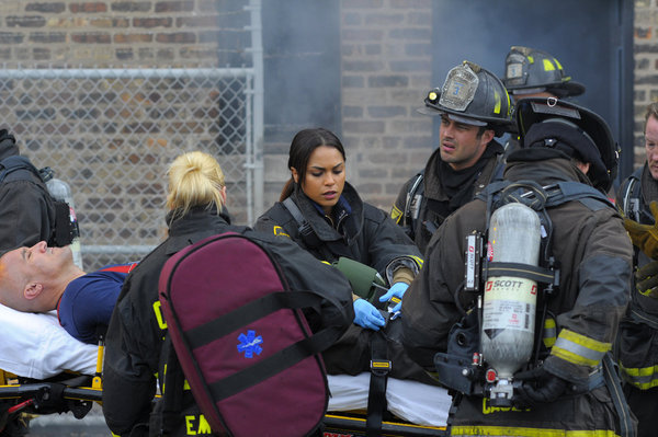 Still of Taylor Kinney and Monica Raymund in Chicago Fire (2012)