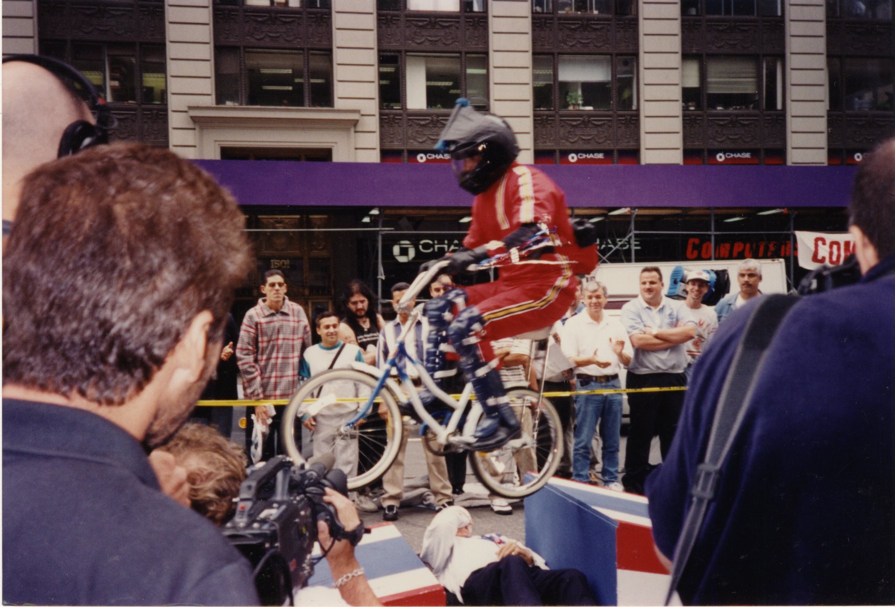 David Copeland performing a ramp to ramp bicycle jump over Evel Knievel in the middle of Times Square, NYC for Viva Variety on Comedy Central.