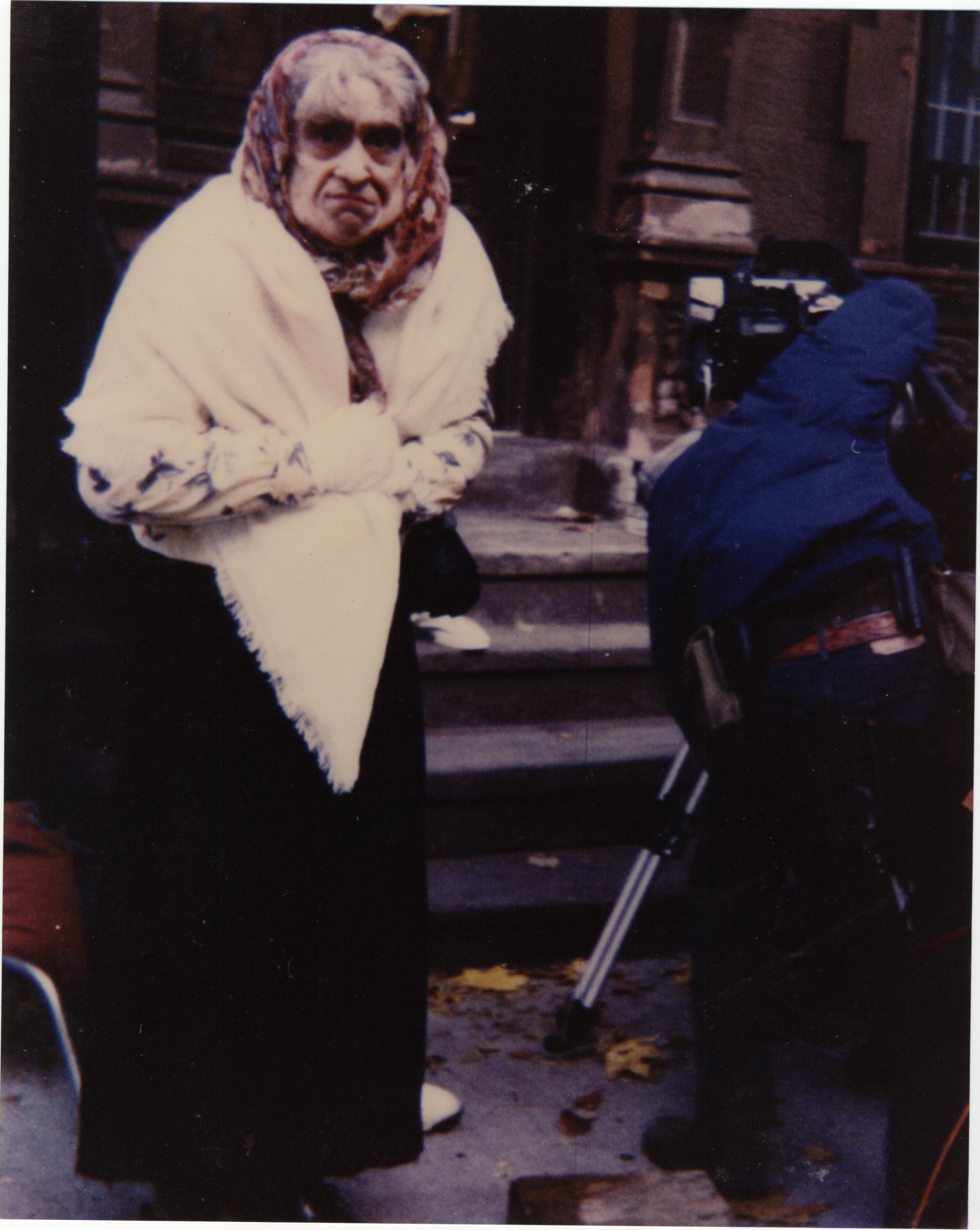 David Copeland as an old lady who falls down a flight of stairs in 'Joe's Apartment'.