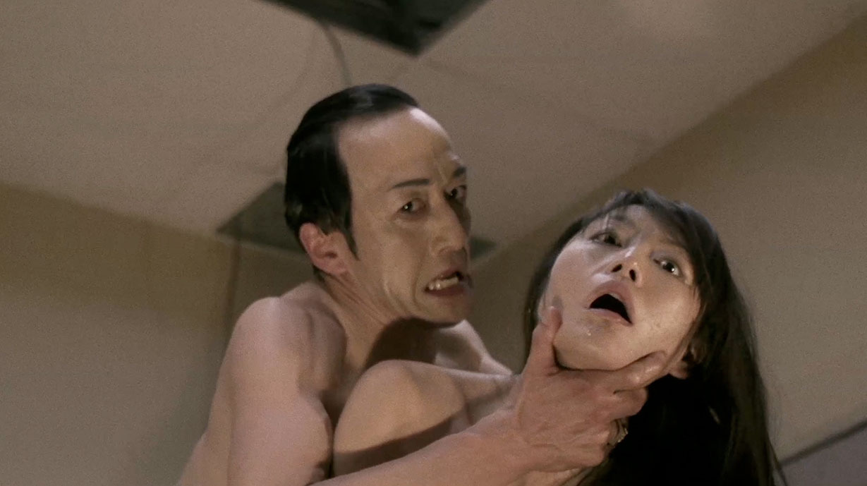 Still of Noriaki Kamata and Asami in Gun Woman (2014)