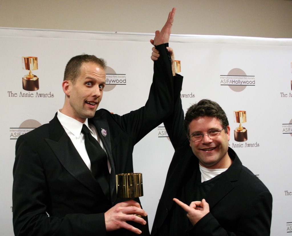 Presenter Sean Astin congratulates feature directing winner Pete Docter