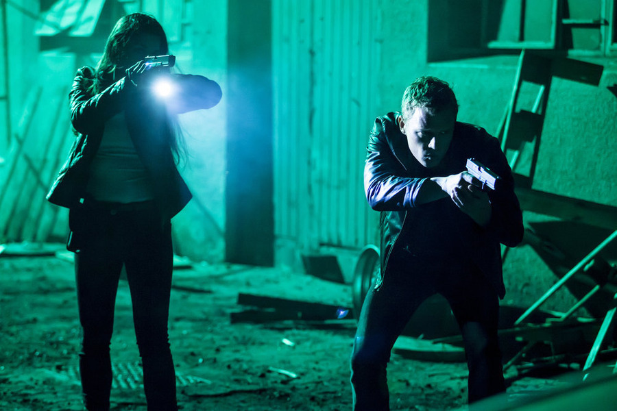 Still of Kim Engelbrecht and Chris Egan in Dominion (2014)