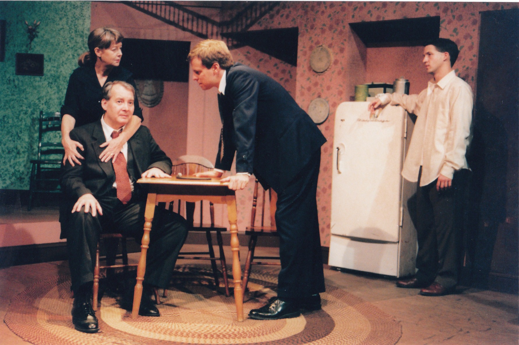 Carol Chittum as Linda Loman, Rich Hamilton as Willy Loman, Scott Rollins as Biff Loman, and David Hart as Happy Loman in DEATH OF A SALESMAN The Generic Theater Norfolk, VA 1999