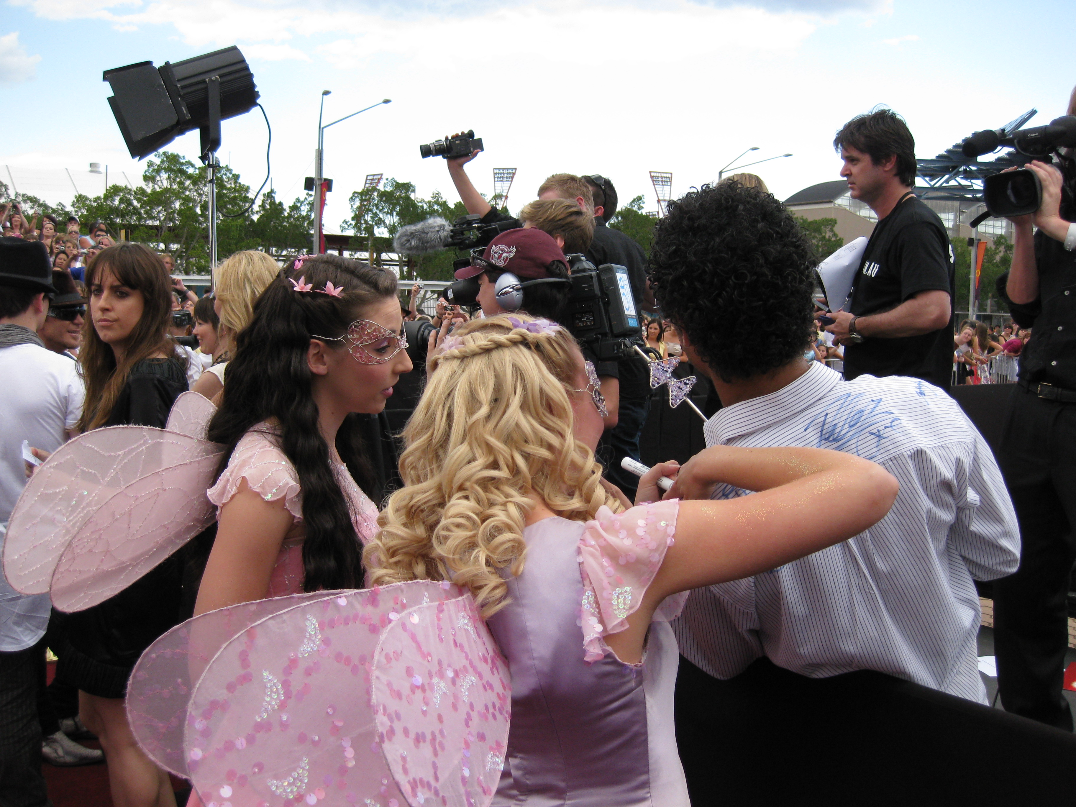 Actress Candice Moll signs autographs for fans at the Australian Record Industry Awards.