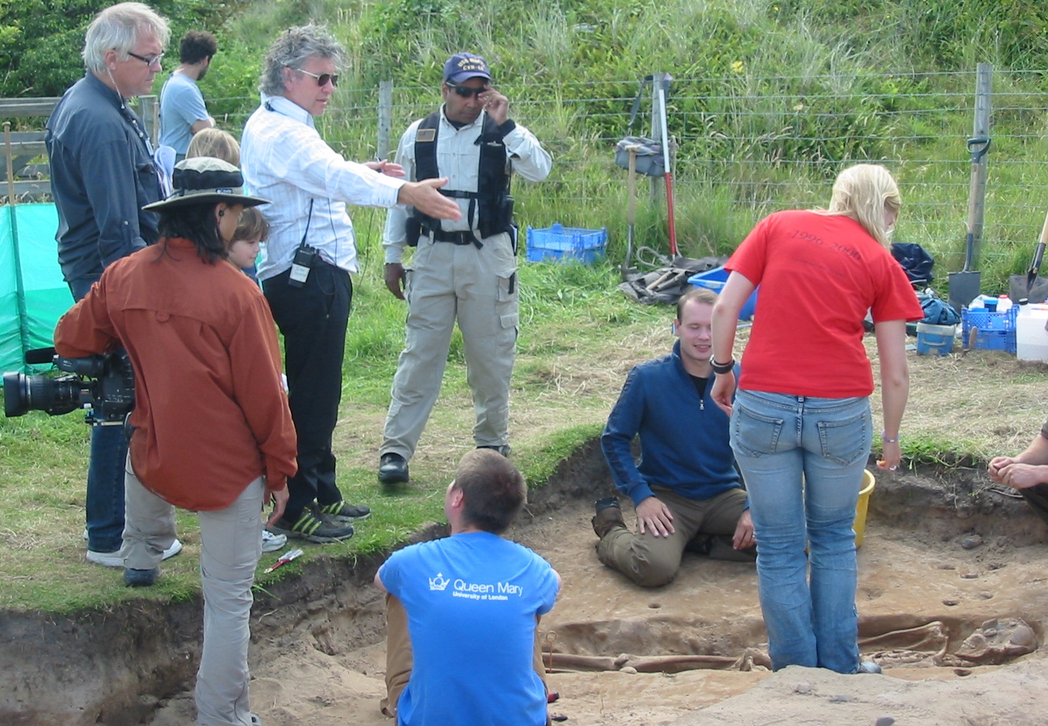 TV director Ian Stevenson (in white shirt) directs The Discovery Channel's 'Bone Detectives' in northern England. Host Scotty Moore kneels beside mummy. More at www.ianstevenson.tv