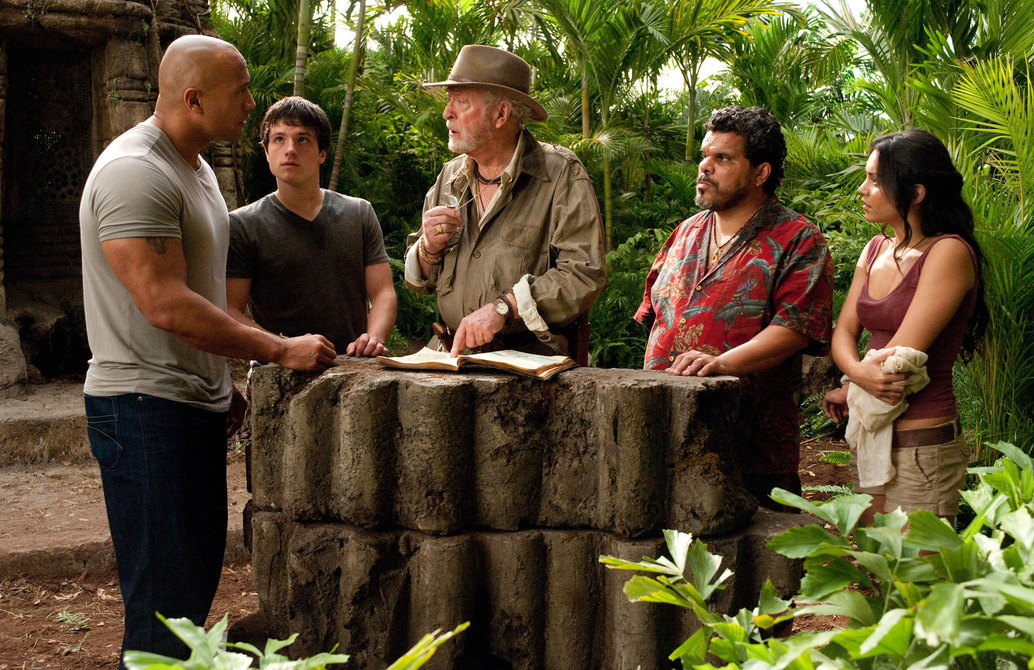 Still of Michael Caine, Luis Guzmán, Dwayne Johnson, Vanessa Hudgens and Josh Hutcherson in Kelione i paslaptingaja sala (2012)