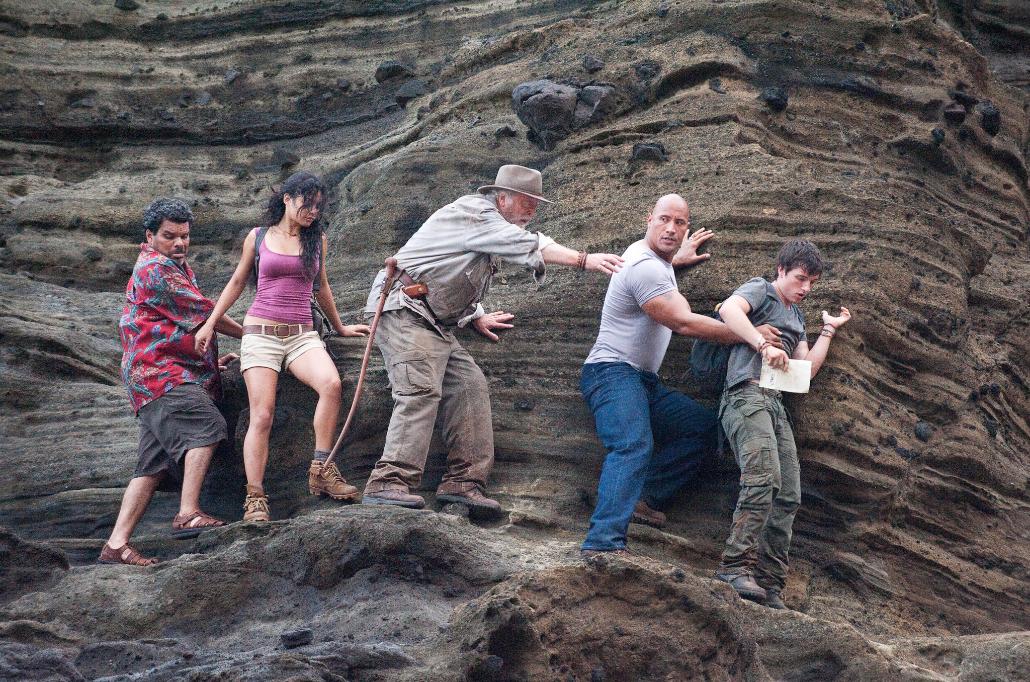 Still of Michael Caine, Luis Guzmán, Dwayne Johnson, Vanessa Hudgens and Josh Hutcherson in Kelione i paslaptingaja sala (2012)