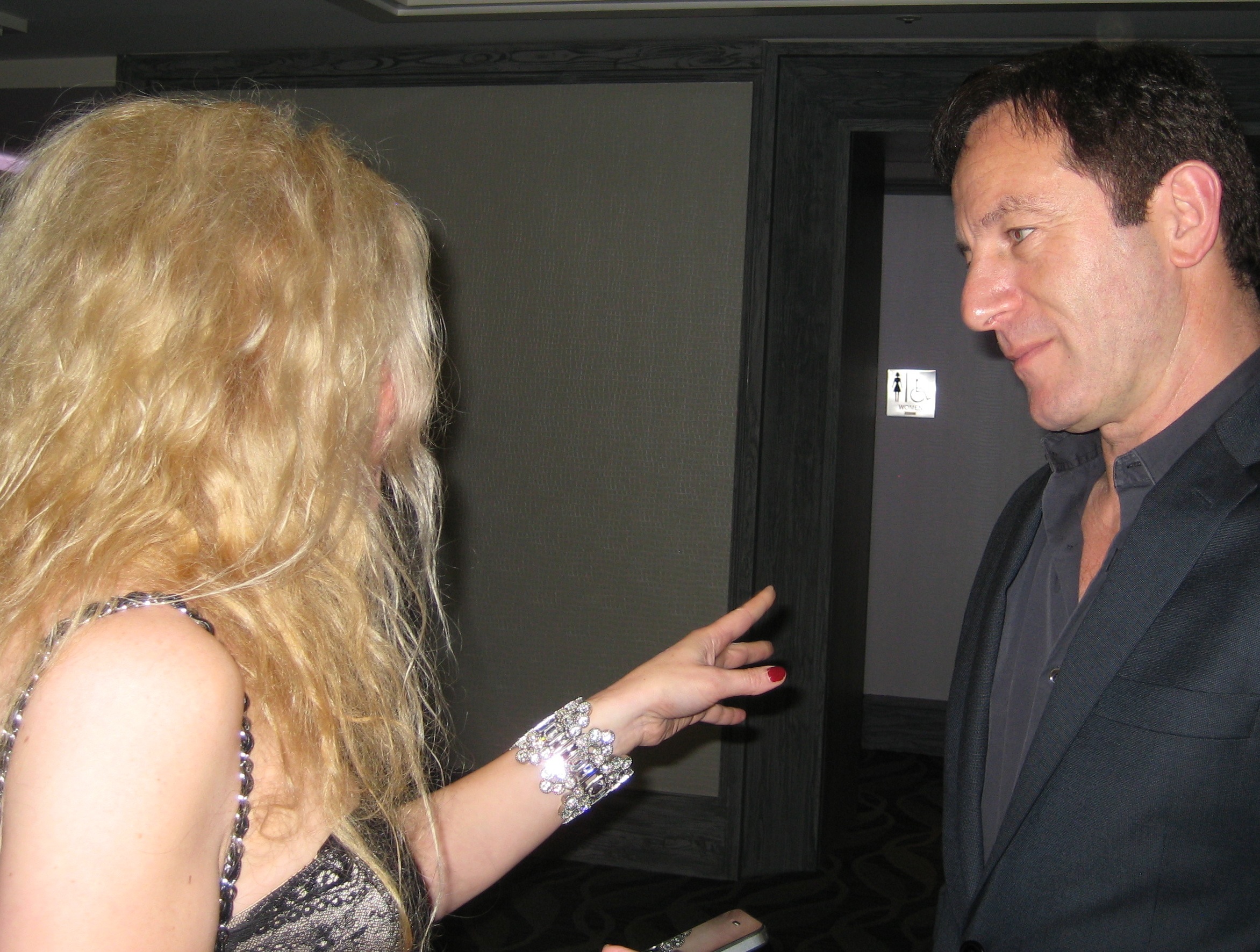 Adrienne Papp of Atlantic Publicity interviewing Jason Isaacs at the 2012 International Press Academy Satellite Awards, December 16, 2012