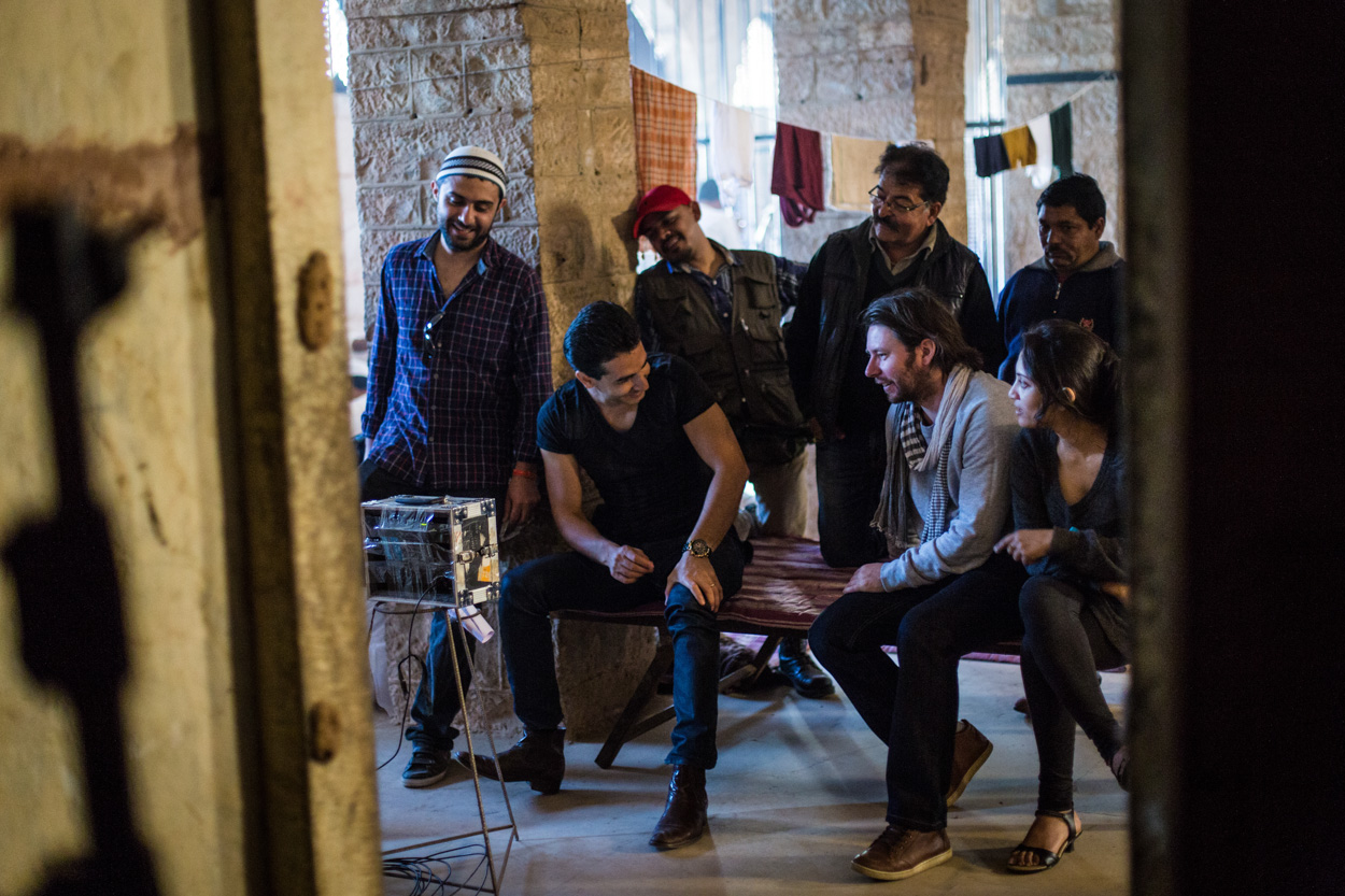 Some of the cast & crew enjoy a laugh on set in India during principle photography of 'Utopia' 2014.