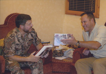 Bestselling Author Vince Flynn presents King Abdullah II a copy of his novel 