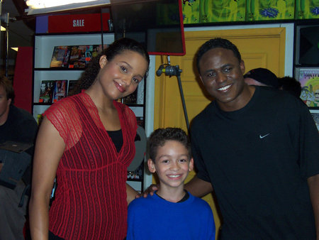 Jorden Davis takes a break after filming a scene in I'mPerfect with Sydney Tamiia Poitier and Wayne Brady.