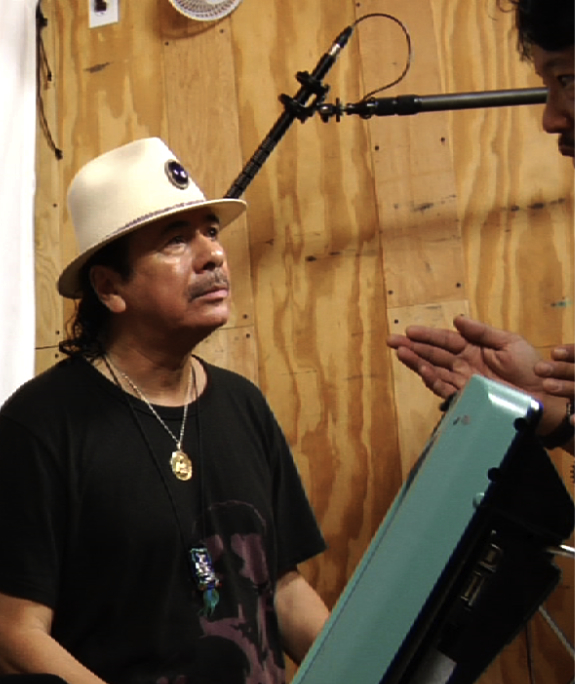 Carlos Santana and Craig Abaya on the set of Bridge School News.