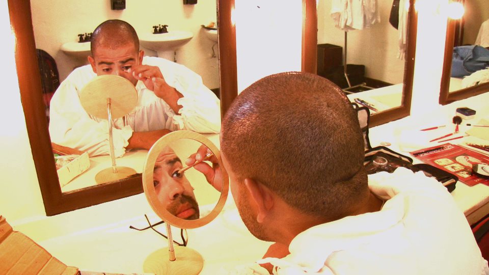 Eliezer Ortiz is getting ready and putting the makeup on for the role of Commandante in The Mission Play at the San Gabriel Mission Playhouse.