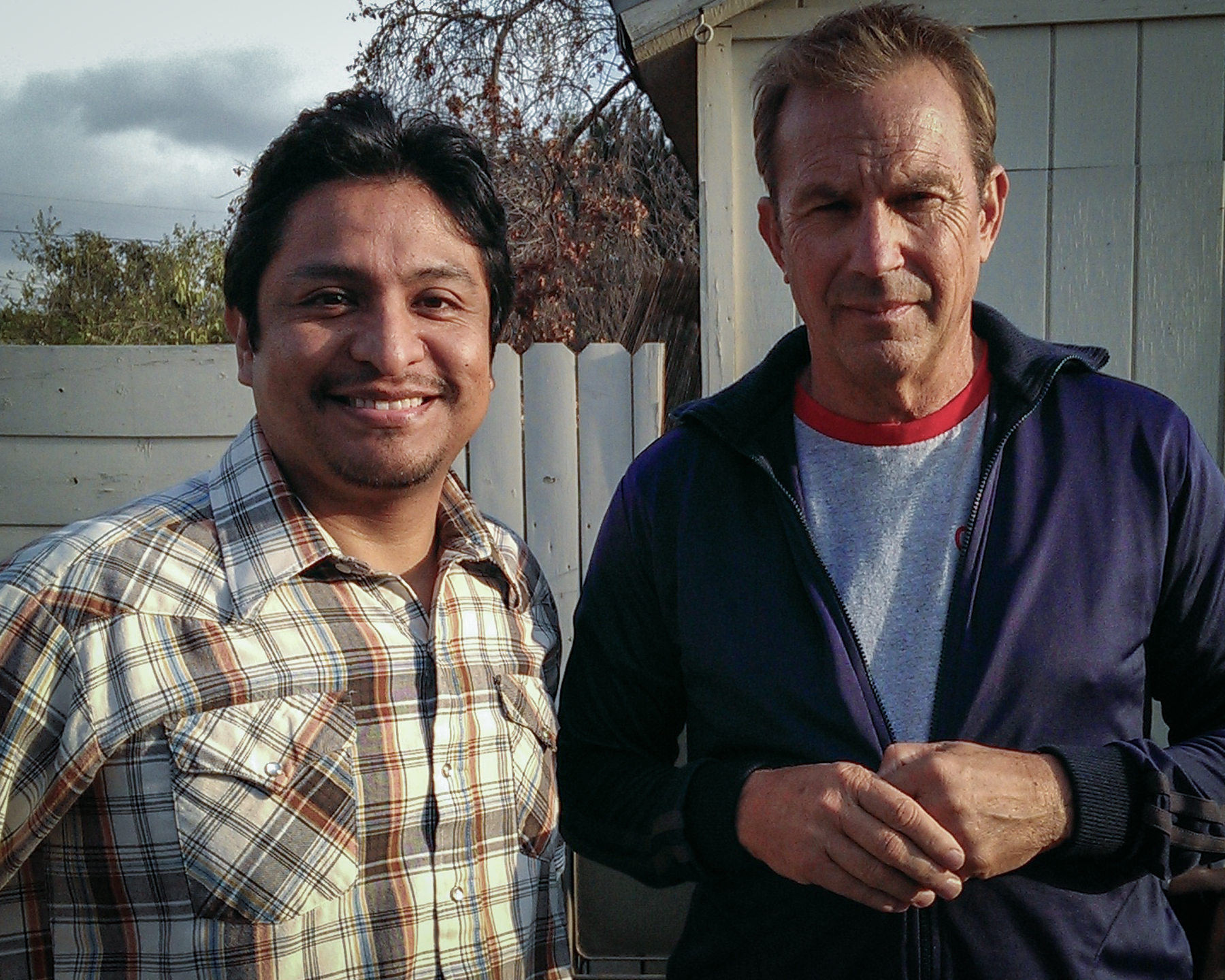 Omar Leyva and Kevin Costner on the set of McFarland, USA
