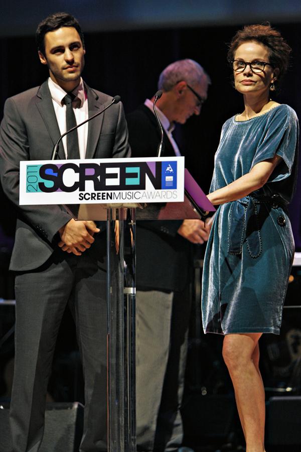 RIchard Brancatisano presenting at the 2011 Screen Music Awards with Sigrid Thornton