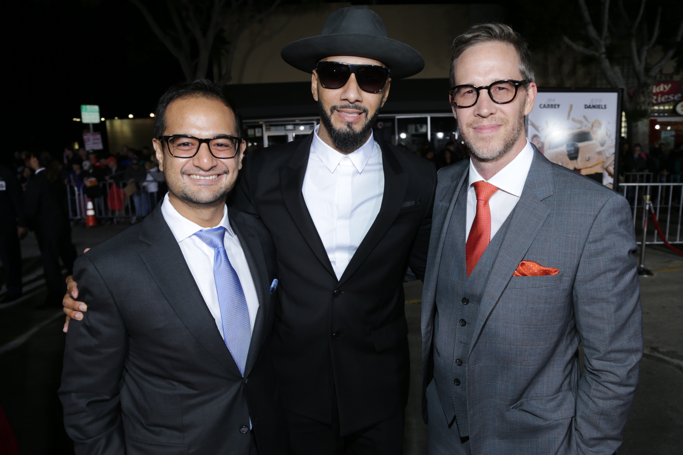 Riza Aziz, Swizz Beatz and Joey McFarland at the Dumb and Dumber To Premiere in Los Angeles.