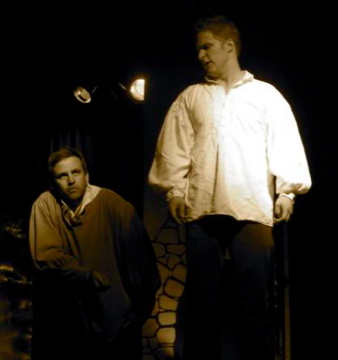 Brett Merritt and Maclain Nelson on stage performing improvised Shakespeare.