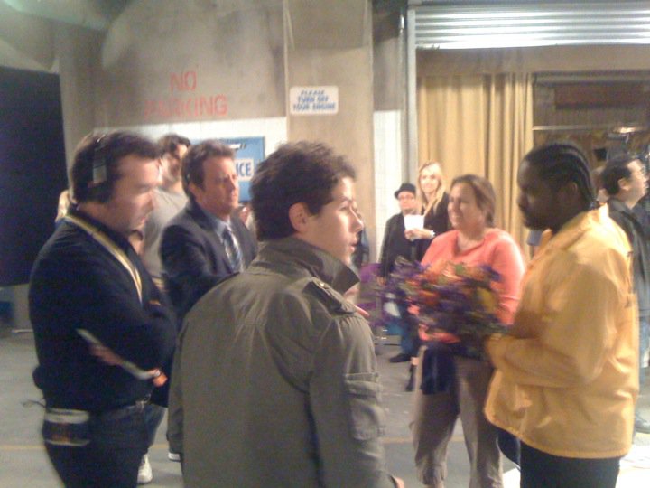 Carl McDowell, Matthew Perry, and Nick Jonas taking direction on the set on Mr. Sunshine
