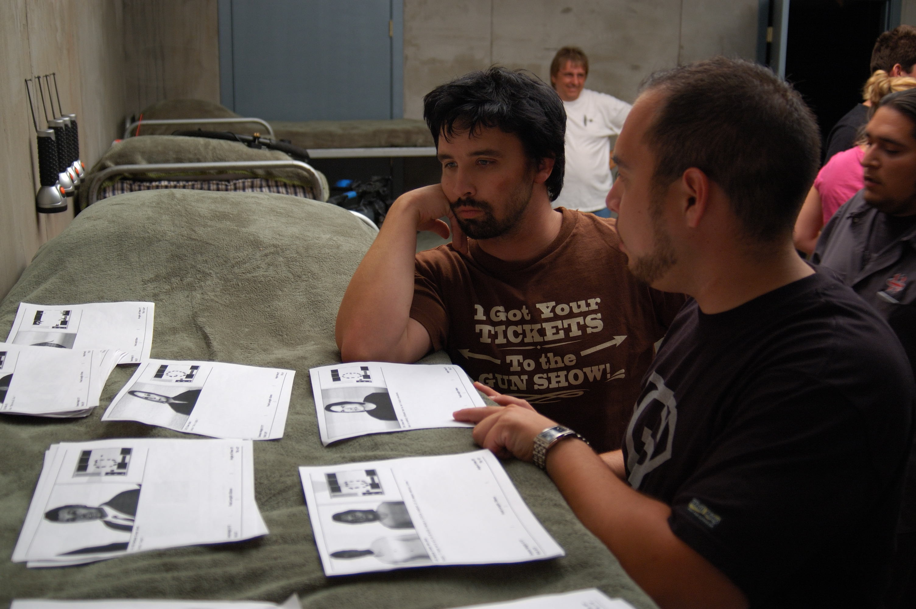 Chris Elston and Robert Perez pour over storyboards on the set of SHELTER