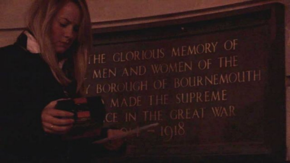 Iona (Jaimme Bird) at the memorial receiving a message