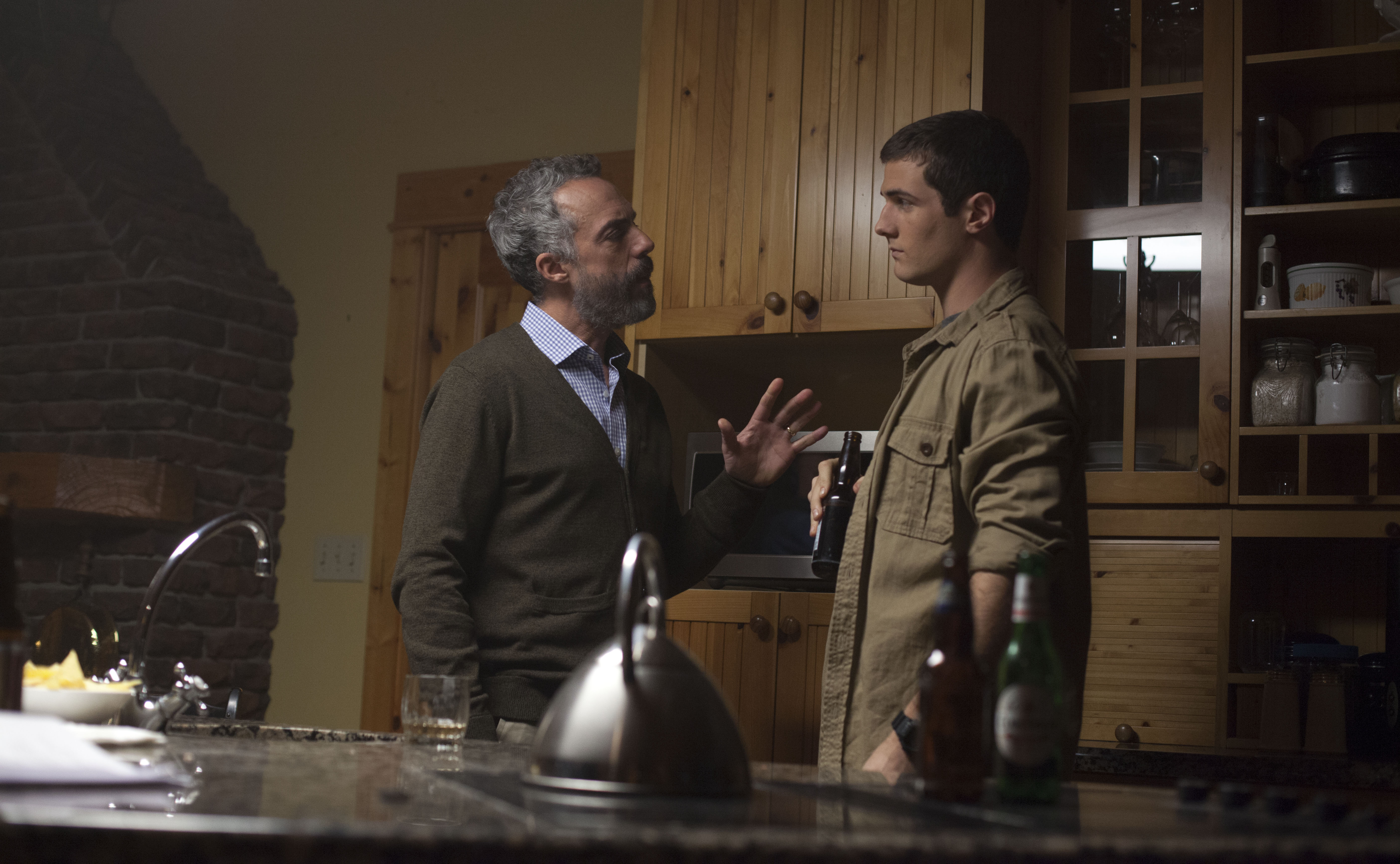 Still of Titus Welliver and Beau Mirchoff in Poker Night (2014)